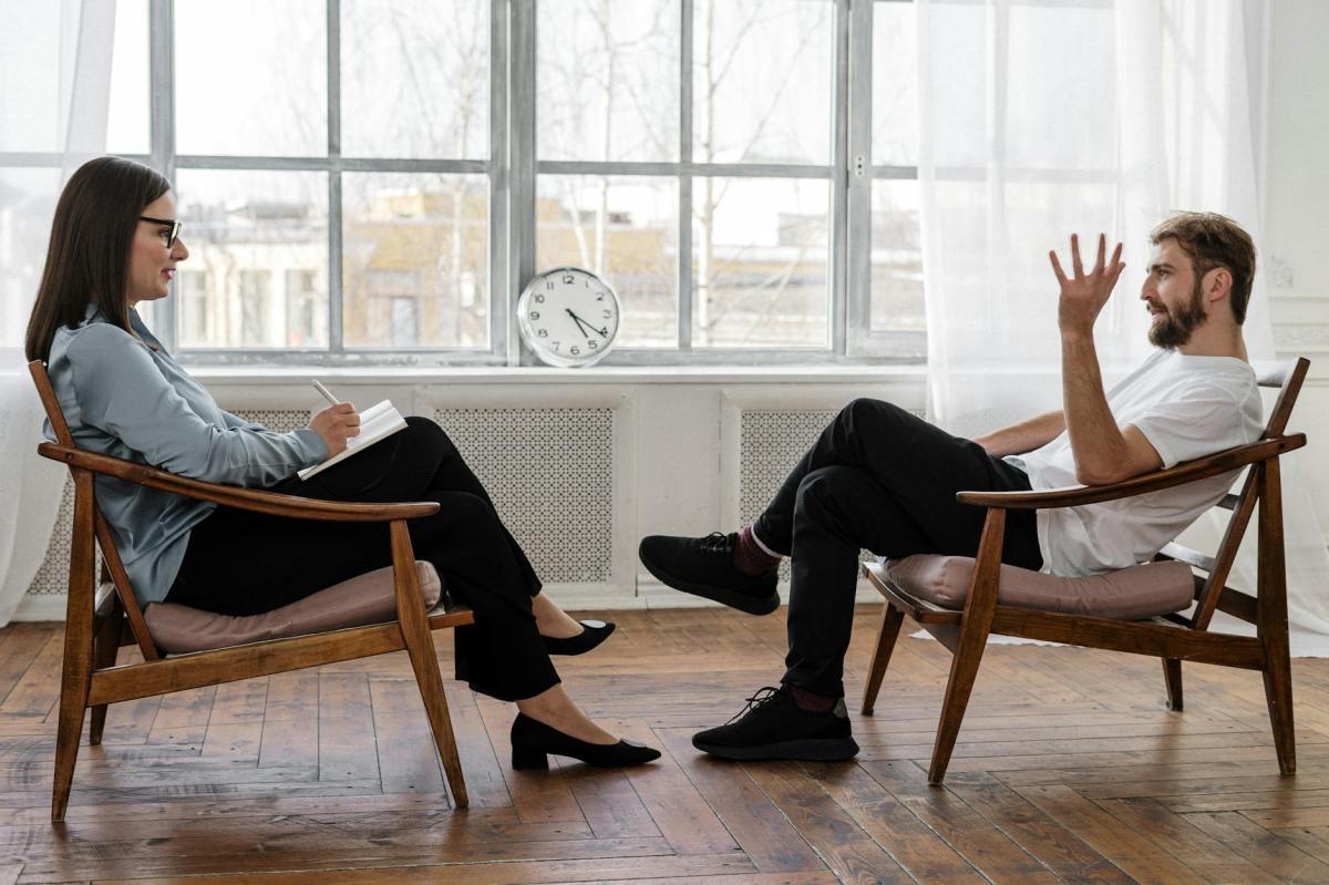 A quiet chair in a warm therapy space