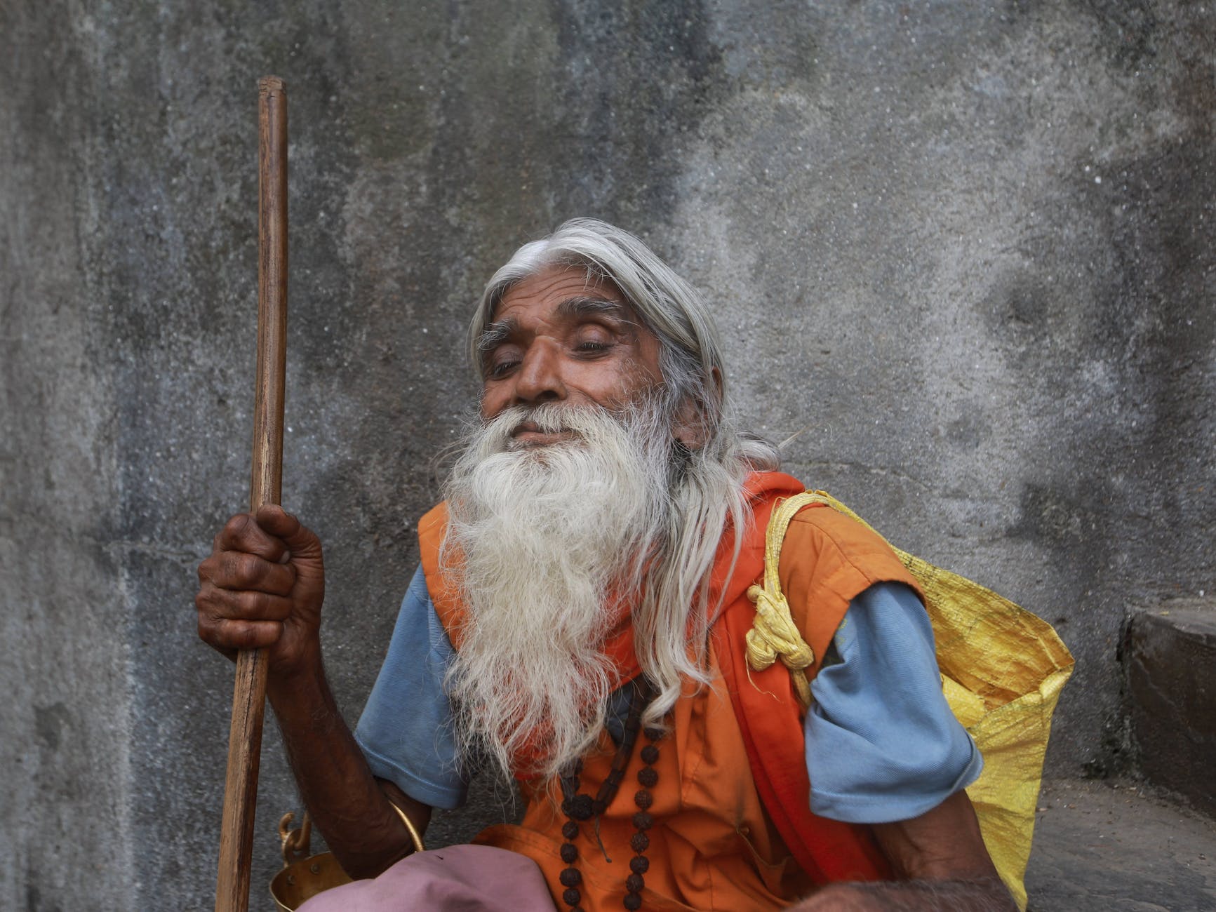 man with a long beard and a cane